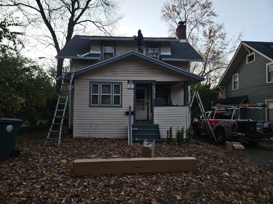 Lansing CS Roofing crew performing a shingle roof repair on a residential home in Lansing, Michigan.